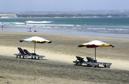 indonesia bali beaches. Beach and umbrellas in Bali.