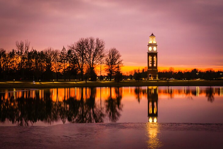 Bell tower and lake at Coxhall Gardens in winter