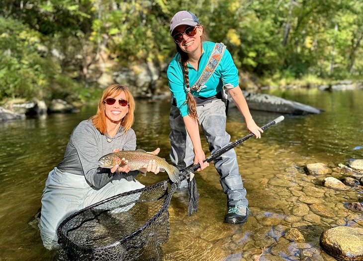 Author Anietra Hamper with a rainbow trout near Blowing Rock