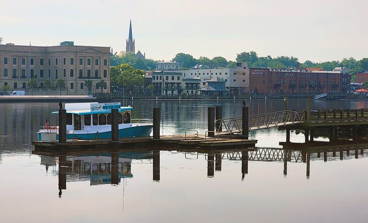 A water taxi docked near the Battleship North Carolina and downtown Wilmington across the river