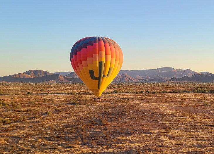 A hot air balloon rising over the desert near Scottsdale 