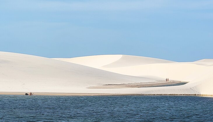 People enjoying the dunes and lakes in Lençóis Maranhenses National Park