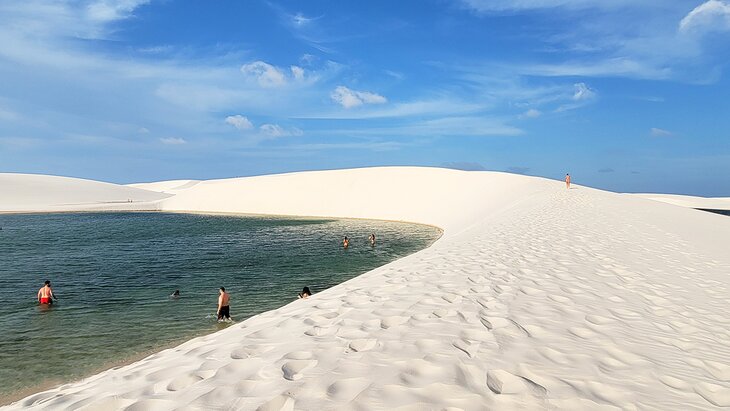 People swimming in Lençóis Maranhenses National Park