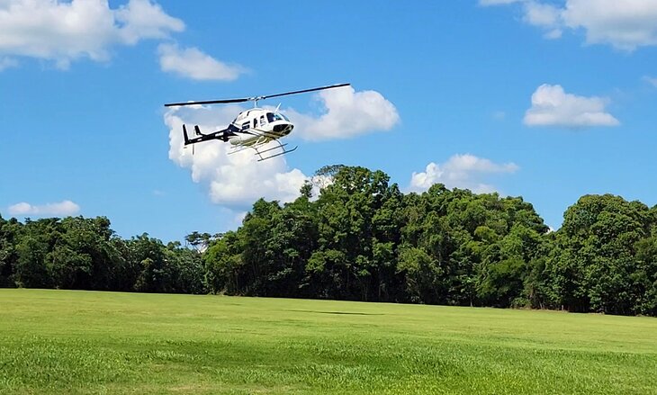 A helicopter coming in to pick up passengers